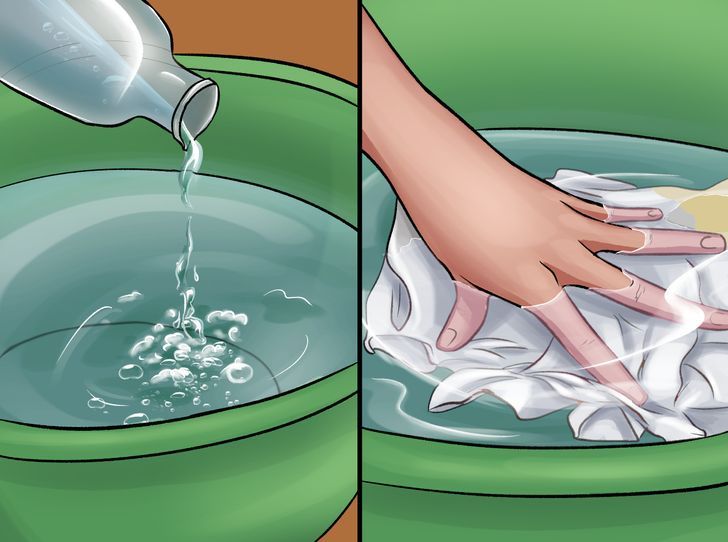 a person is washing their hands in a green bowl with water pouring out of it