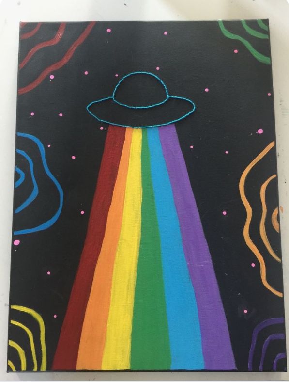 an image of a painting with a rainbow in the sky and a space ship painted on it