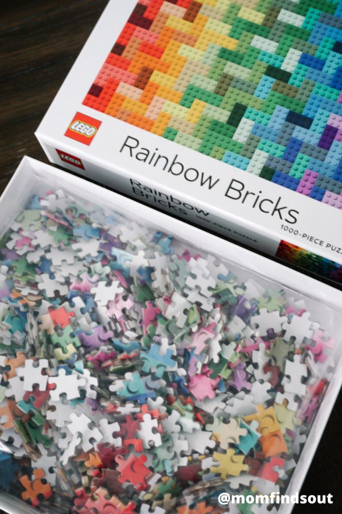 a box filled with lots of colorful puzzle pieces