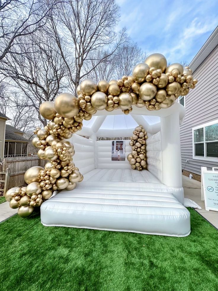 an inflatable arch decorated with gold ornaments