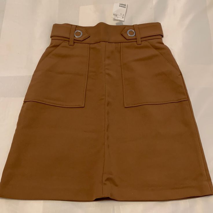 Brand New Brown High Waisted Midi Skirt From H&M. The Fabric Is Thick And Not Very Stretchy. 67% Polyester 33% Viscose. Super Cute And Closet Staple! H&m Midi Skirt With Lining, H&m Lined Midi Skirt, H&m Midi Lined Skirt, Brown Mini Skirt For Summer Workwear, Brown Summer Mini Skirt For Workwear, Brown Mini Length Bottoms For Workwear, Summer Brown Mini Skirt For Work, Brown Pencil Skirt With Pockets, H&m Relaxed Midi Skirt