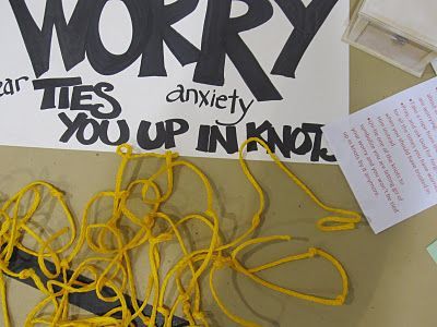 there is a sign that says sorry and yellow cords are in front of it on the wall