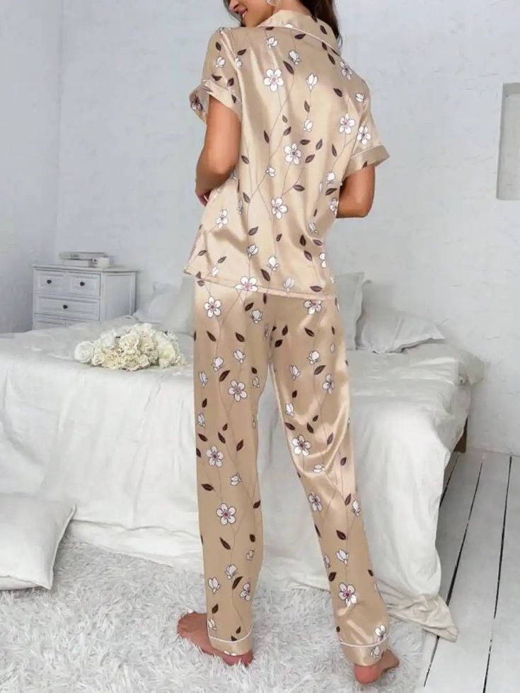 Experience the epitome of comfort with our Floral Print Contrast Piping Satin Pajama Set, featuring a delightful floral print and contrasting piping. This two-piece ensemble includes a short sleeve button-front top with convenient pockets and a pajama. Crafted from non-stretch fabric, it offers both elegance and relaxation for your leisure time. Features: Style: Fantasy-Elegant Pattern Type: Floral Type: Pant Sets Neckline: Lapel Details: Pocket, Contrast Binding, Button Front Sleeve Length: Sho Floral Print Short Sleeve Sleep Set, Floral Print Sleep Sets With Short Sleeve, Short Sleeve Floral Print Sleep Sets, Short Sleeve Floral Sleep Set, Casual Beige Floral Print Sets, Floral Print Short Sleeve Sleepwear For Comfort, Floral Print Short Sleeve Sleepwear Set, Beige Home Sets For Spring, Printed Short Sleeve Sets For Home