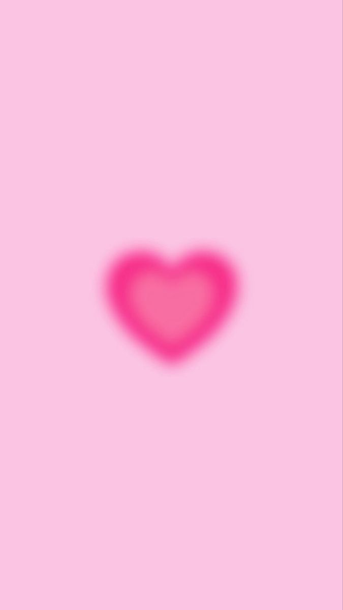 a heart shaped object on a pink background