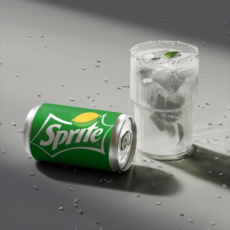 a can of sprite soda next to a glass filled with ice and water droplets