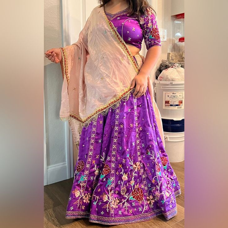 Purple Heavy Handwork Lehenga Customized Size 40 -42 Bust Size - 41 Inches Lower Bust - 36 Inches Waist - 38 Inches Hips -47 Inches Lehenga Length- 39 Inches Gaji Silk Material With Hand Work All Over Wore It Once In Very Good Condition & No Rips Purple Floor-length Traditional Wear For Navratri, Embroidered Purple Sharara, Embroidered Purple Sets For Navratri, Purple Choli With Zari Work, Purple Embroidered Anarkali Choli, Anarkali Embroidered Purple Choli, Purple Sets With Dori Work In Traditional Drape, Purple Lehenga With Zari Work, Purple Zari Work Choli