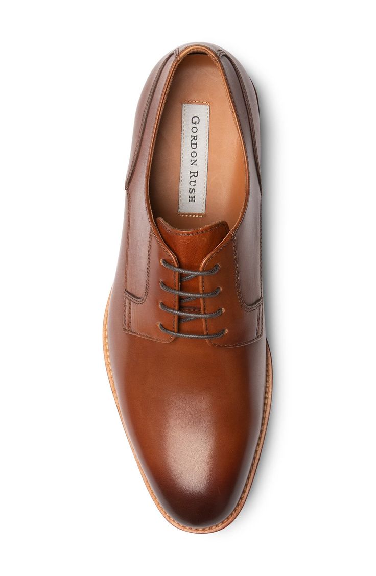 Classic derby styling underscores the timeless appeal of a handsome Italian-leather shoe featuring Blake stitch construction and a breathable leather lining. Lace-up style Removable OrthoLite® cushioned insole Leather upper, lining and sole Imported Men's Shoes Leather Plain Toe Oxfords For Semi-formal Occasions, Workwear Derby Shoes With Branded Insole And Almond Toe, Plain Toe Oxfords With Leather Lining For Semi-formal, Semi-formal Plain Toe Oxfords With Leather Lining, Almond Toe Oxfords With Leather Footbed For Derby, Semi-formal Plain Toe Lace-up Shoes With Leather Lining, Formal Plain Toe Derby With Leather Footbed, Masculine Leather Lace-up Oxfords, Leather Lace-up Shoes With Branded Insole For Business Casual