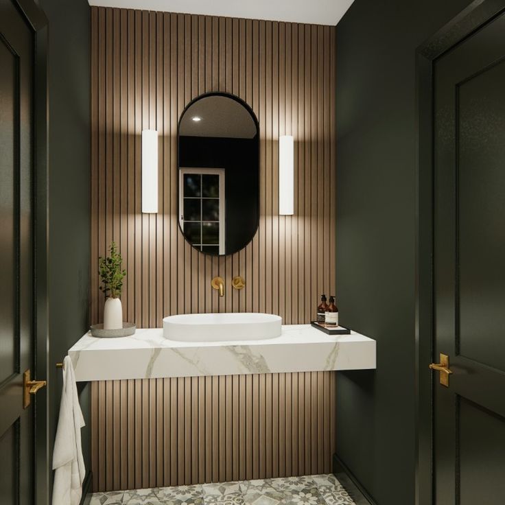 a white sink sitting under a mirror in a bathroom next to a wooden paneled wall