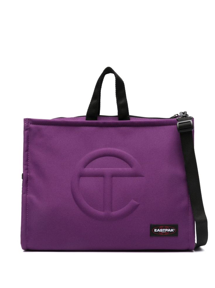 purple/black embossed logo to the front appliqué logo two top handles two padded adjustable shoulder straps top zip fastening main compartment internal padded laptop pocket mesh pockets to the side full lining Purple Satchel Bag For On-the-go, Telfar X Eastpak, Purple Nylon Backpack, Purple Rectangular Nylon Backpack, On-the-go Purple Bag With Detachable Strap, Backpack Purple, Rectangular Purple Backpack For On-the-go, Eastpak Backpack, Purple Backpack