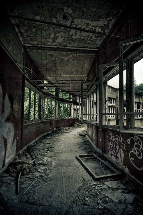 an abandoned building with graffiti on the walls