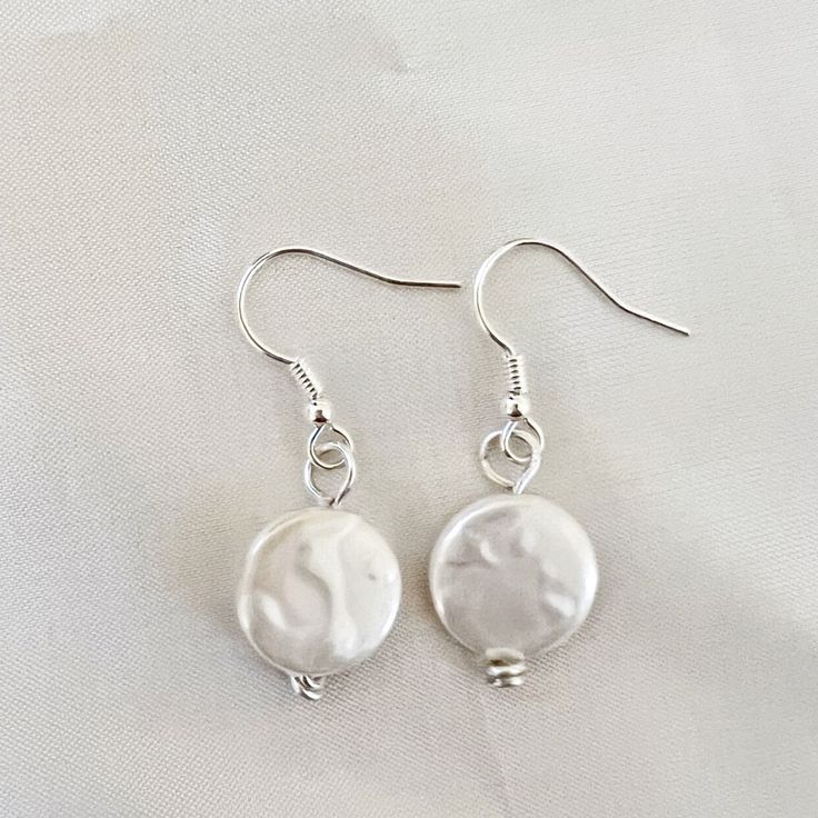 Tiny Freshwater Pearl Coin 10mm Flate Drop Earrings. Natural Freshwater Pearl 10mm. Silver Plated French Hooks Nickle Free Handmade Pearl White Round Earrings For Everyday, Everyday White Round Pearl Earrings, White Round Bead Earrings For Everyday, Everyday White Drop Earrings, White Dangle Pearl Earrings For Everyday, White Round Pearl Charm Earrings, Nickel-free White Drop Pearl Earrings, Hypoallergenic White Pearl Earrings With Round Beads, White Hypoallergenic Round Pearl Earrings