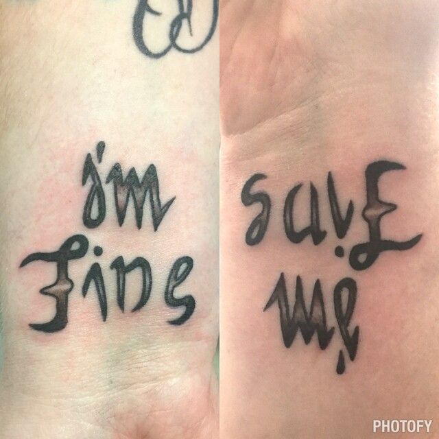 two wrist tattoos that say i'm fine and save me