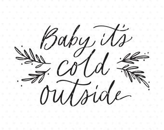 the phrase baby it's cold outside is shown in black ink on a white background