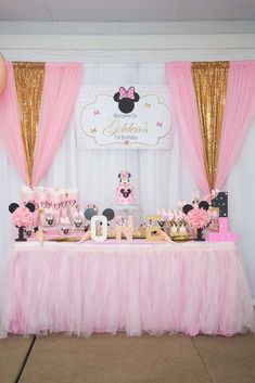 a pink and gold minnie mouse birthday party