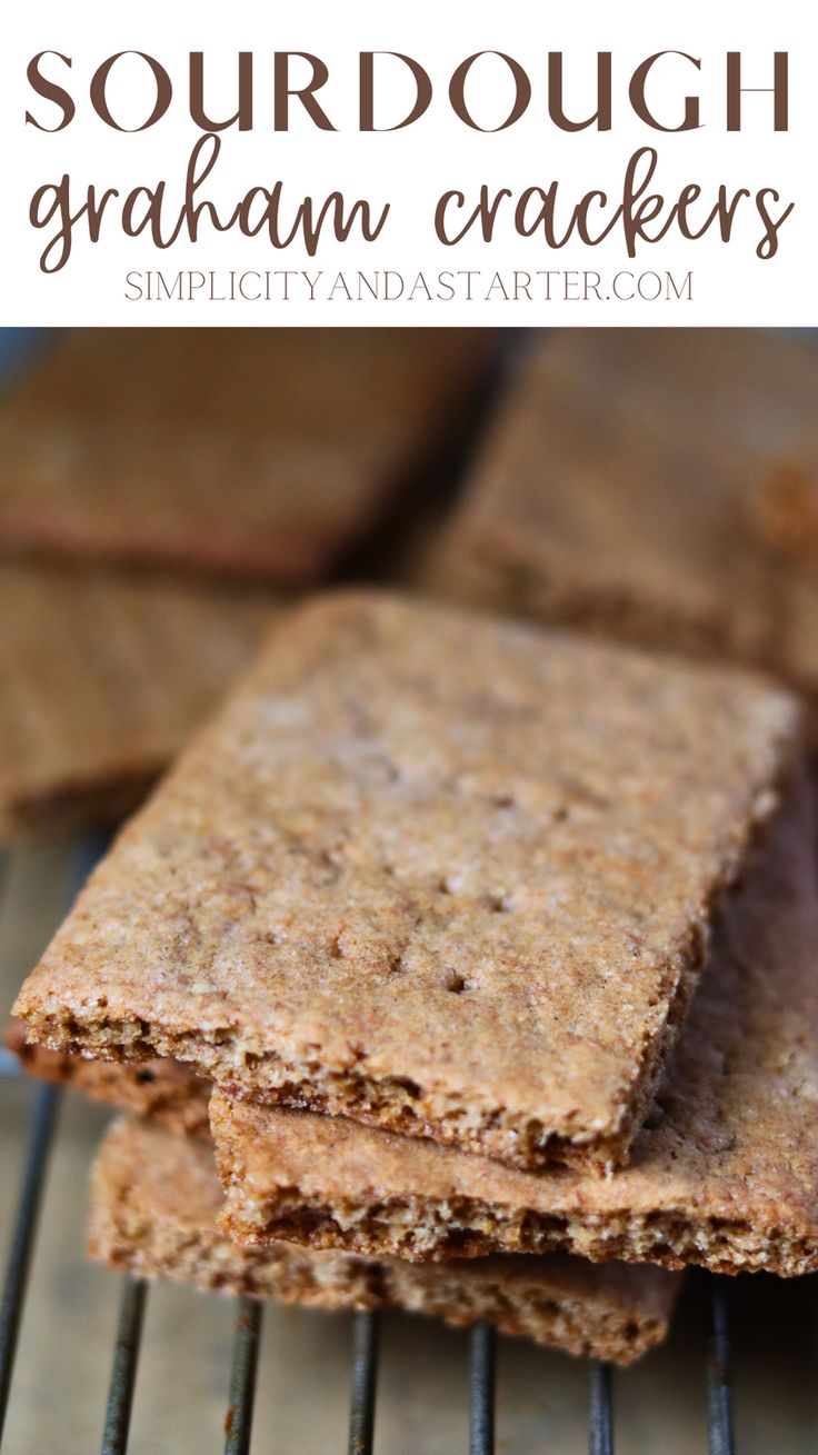 some crackers are cooling on the grill with text overlay that says sourdough graham crackers