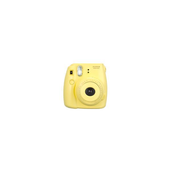 a yellow camera sitting on top of a white surface