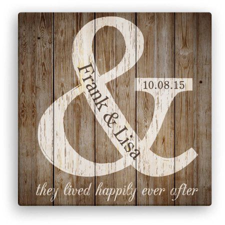 a wooden sign with the words happily married and an amp logo on it's side