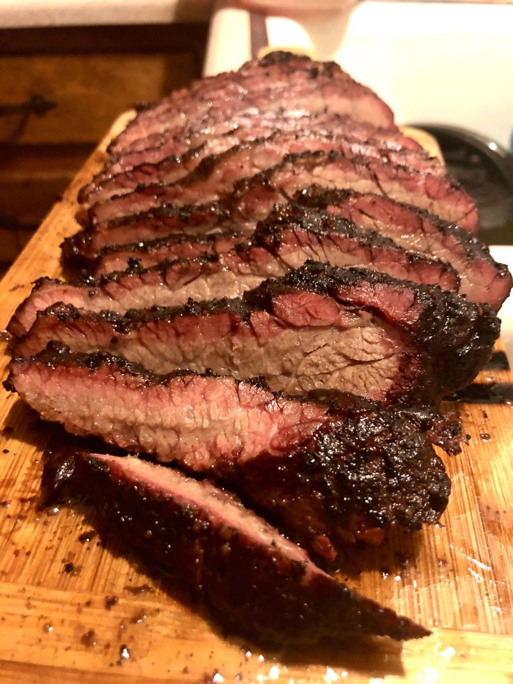 sliced steak on cutting board ready to be cooked