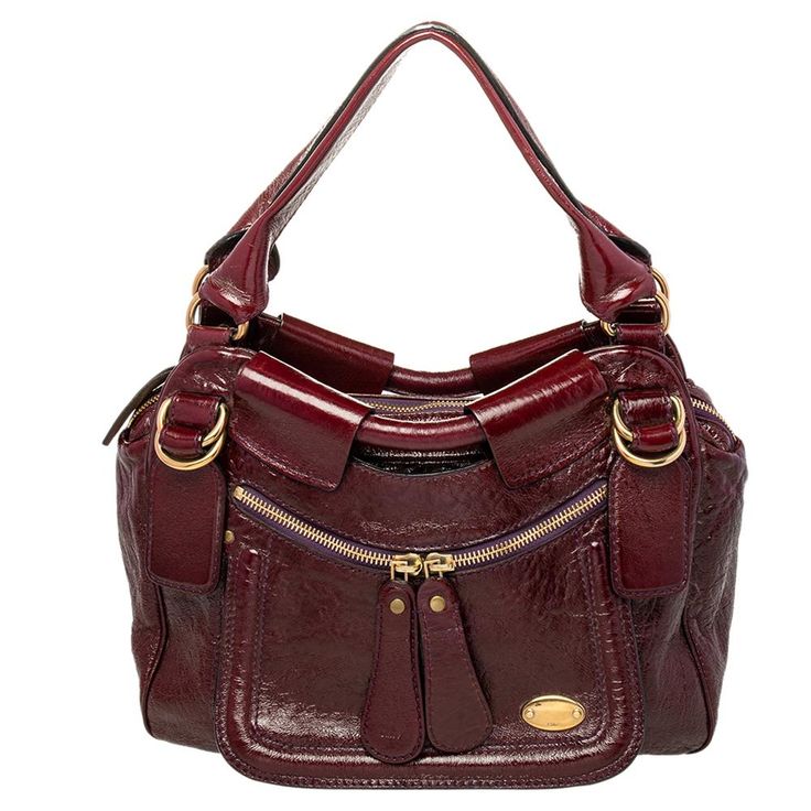 This burgundy patent leather bag is fabulously built and extremely alluring. An epitome of fashion, this beautifully crafted bag comes with a highly durable fabric interior. Complement the diva in you by adorning this attractive satchel from Chloe. Crafted Bag, Everyday Handbag, Chloe Bags, Patent Leather Bag, Chloe Purses, The Diva, Beaded Handbag, Chloe Bag, Cute Bags