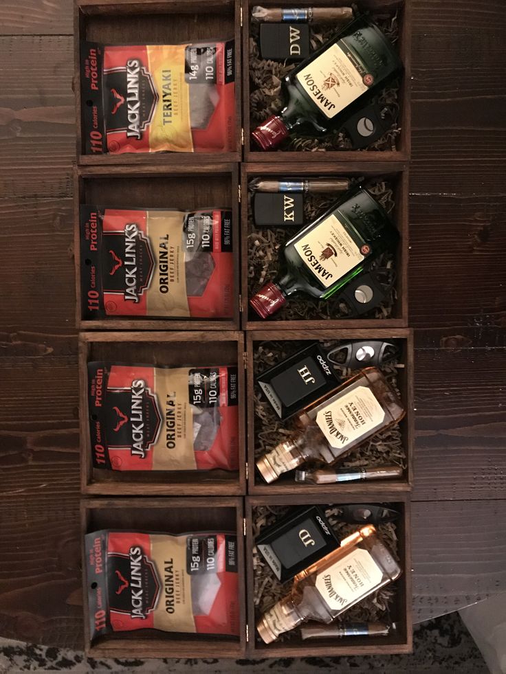 a wooden box filled with different types of liquor