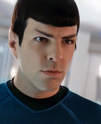 an image of a man in a star trek uniform looking at the camera with eyes wide open