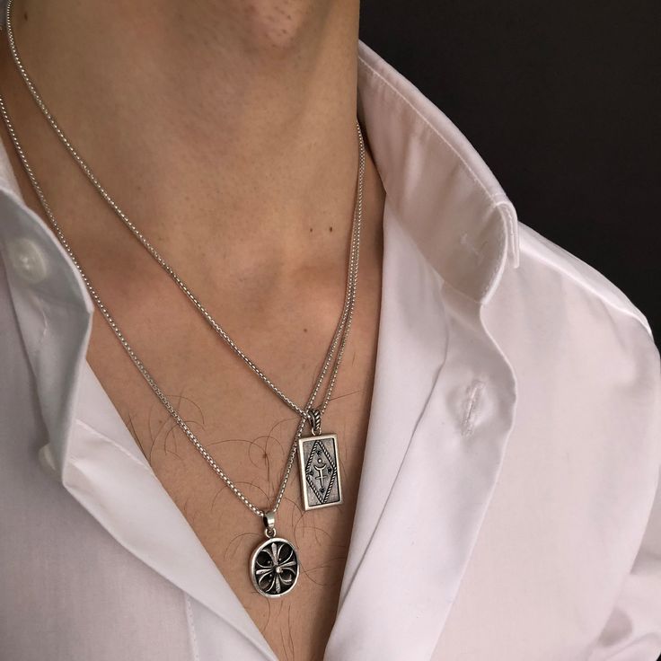 A darkened silver Hades pendant designed with his symbol at the center of a diamond and four black stones. Hades was the brother of Zeus and Poseidon who was god of the Underworld and the lover of Persephone, his Queen. The rounded box chain is 18" long with a 2" extension. All 925 Sterling silver. All orders over $50 ship for free within the USA. All orders usually ship within 24 hours from the USA. Luxury Men's Amulet Style Jewelry, Hades Symbol Necklace, Aesthetic Pendants Men, Cool Men Jewelry, Symbolic White Gold Box Chain Necklaces, Symbolic White Gold Necklaces With Box Chain, Symbolic White Gold Necklace With Box Chain, Silver Cross Pendant Necklace With Box Chain, Black Symbolic Necklace With Large Pendant