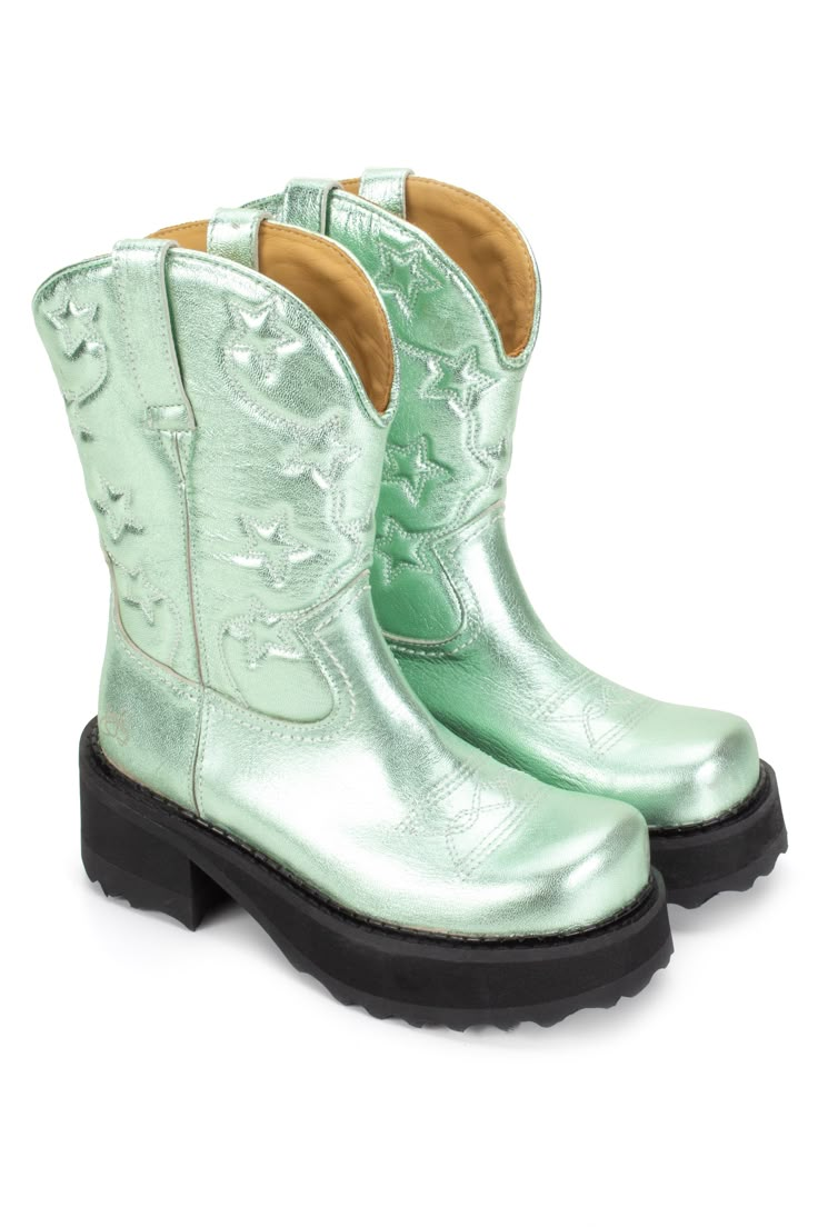 Cowboy Boot, are a pair of peppermint-colored cowboy-style boots with a high black sole Mint Boots Outfit, Funky Cowboy Boots, Platform Cowboy Boots, 2000’s Boots, Green Western Boots, Green Cowgirl Boots, Green Metallic Cowboy Boots, Portugal Style, Short Cowboy Boots