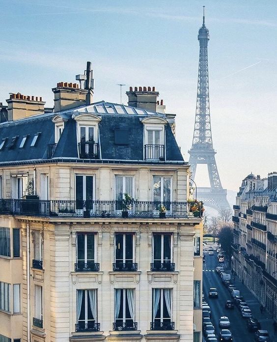 the eiffel tower is in the background of this view from an apartment building