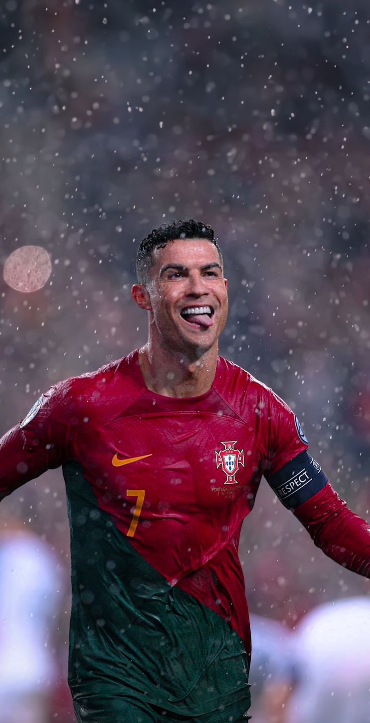 a soccer player in the rain with his mouth open