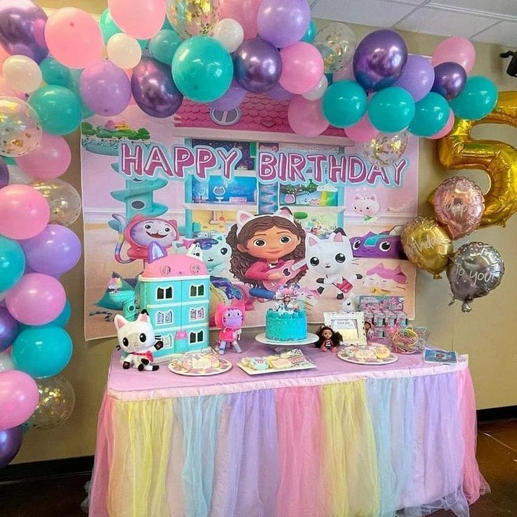 a birthday party with balloons and decorations