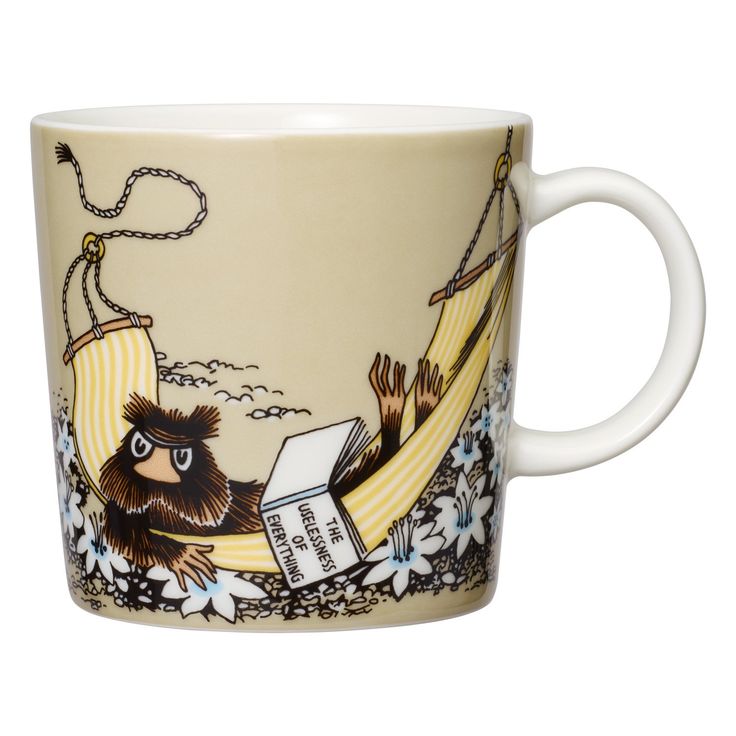 a coffee cup with an image of a monkey on a hammock reading a book