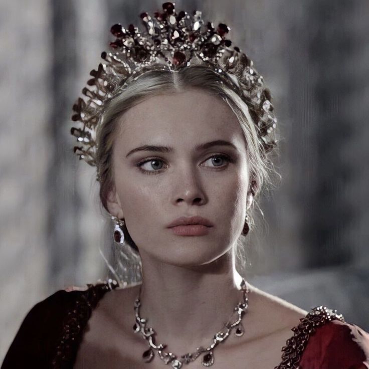 a woman wearing a tiara and jewelry in a scene from the tv game of thrones