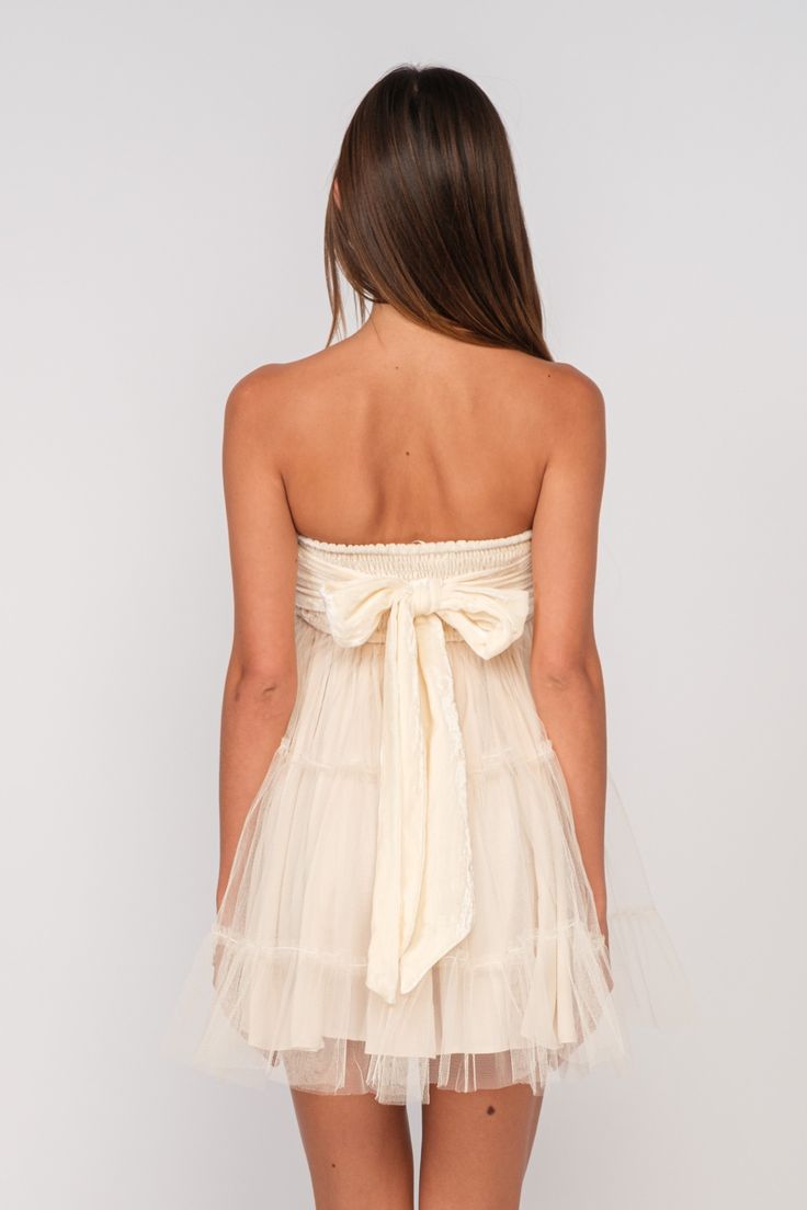 STYLE INFORMATION: The Tessa Cream Velvet Strapless Tulle Babydoll Dress is the perfect party look! Cream velvet fabric forms a strapless babydoll mini dress with attached sheer tulle overlay. Style with black kitten heels for a chic party look! DETAILS & CARE: Polyester. Lining: Polyester. For Best Results Dry Clean. Imported. SHIPPING: Orders are processed within 1-2 business days. Packages are shipped out Monday-Friday, holidays are excluded. Tulle Babydoll Dress, Navy Blue Velvet Dress, Layered Mini Dress, Velvet Tie, Black Kitten Heels, Blue Velvet Dress, Babydoll Mini Dress, Navy Blue Velvet, Boho Pink