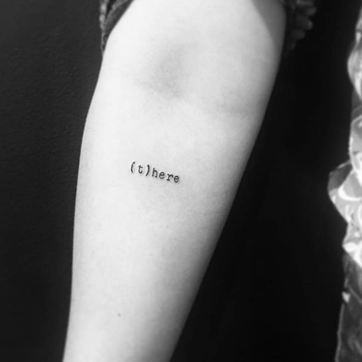 a woman's arm with the word there tattooed on it