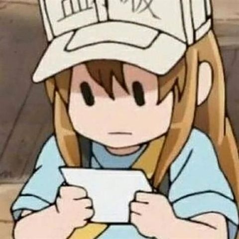 a girl in a baseball cap holding a piece of paper