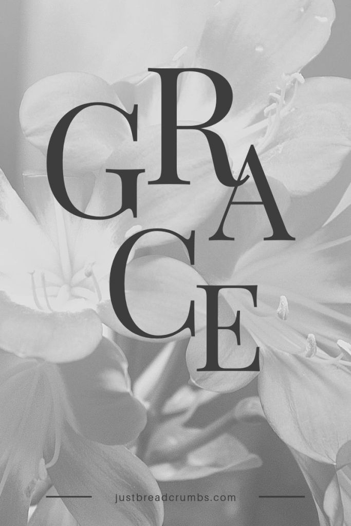 black and white photograph of flowers with the words grace written in large letters on it