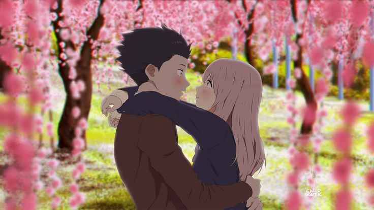 two people standing in front of trees with pink flowers on them and one person hugging the other