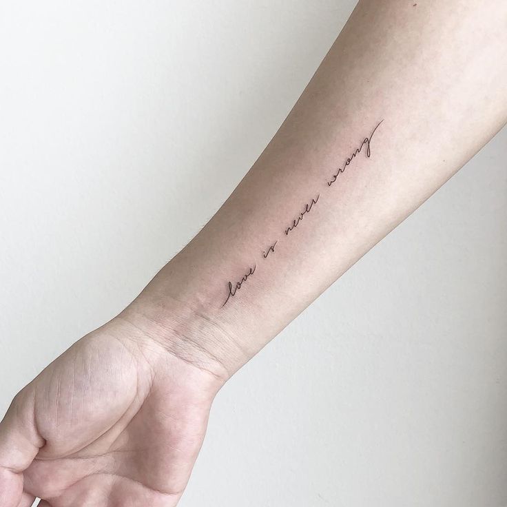 a person's arm with a small tattoo saying, i love you more than me