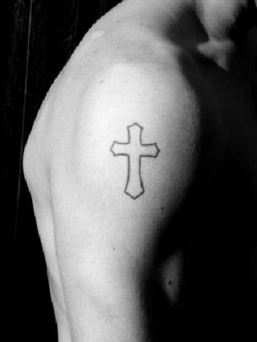 a man with a cross tattoo on his shoulder