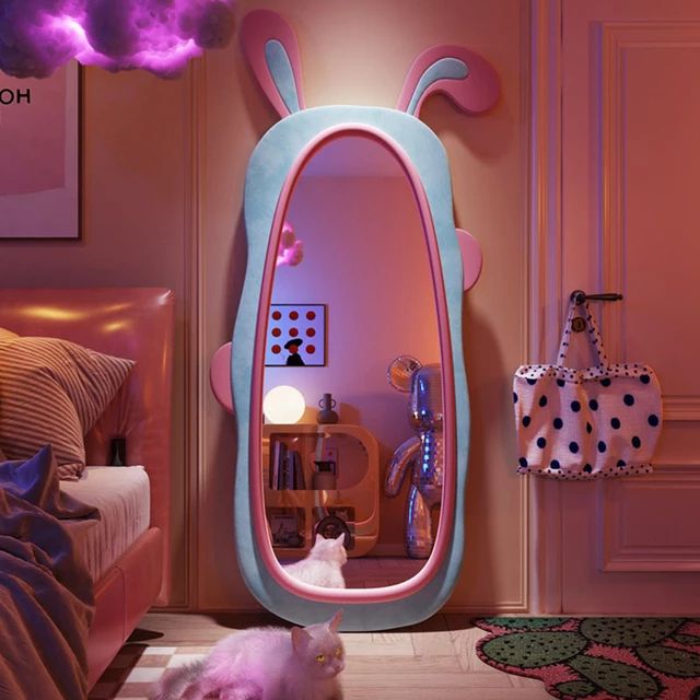 a cat is laying on the floor in front of a mirror that looks like a bunny