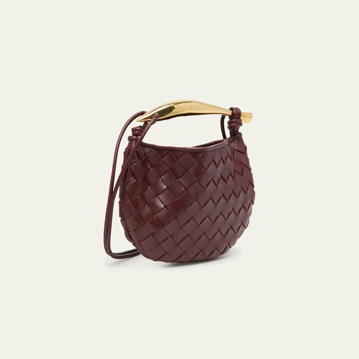 Bottega Veneta top handle bag in  intrecciato  lambskin leather Knotted thing crossbody strap  Metal top handle  Open top with magnetic closure  Approx. 4.7"T x 7.9"W x 0.9"D Made in Italy Luxury Top Handle Shoulder Bag For Errands, High-end Bucket Bag With Detachable Handle, High-end Crossbody Shoulder Bag For Errands, Luxury Shoulder Bag With Handle Drop For Shopping, Luxury Double Handle Hobo Bag For Errands, High-end Top Handle Baguette Bag With Removable Pouch, Designer Shoulder Bag With Gold-tone Hardware And Round Handle, Luxury Shoulder Bag With Round Handle, Shopping Bags With Gold-tone Hardware And Top Handle