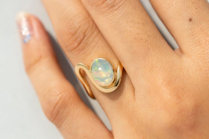 Oval Cut Ethiopian Opal Proposal Ring,14k Solid Gold Deep Curved Wedding Band,Art Deco Solitaire Opal Ring,October Birthstone Ring for Women ★ ★ ★  CUSTOM/DUTY-FREE SHIPPING WORLDWIDE, BUYERS DON'T HAVE TO PAY ANY CUSTOM FEES WHILE IMPORTING ★ ★ ★ ★  Details ★ Made to order Material: 14k/18k Gold Color Options: Yellow Gold, White Gold, Rose Gold ★ Center Stone Ethiopian Opal, Oval  Size: 7x9 mm Approx Weight (Ct): 1.71 ★ 100% Natural Diamond and Gemstones ★ Diamond: Round Brilliant cut, G-H Colo Opal Stone Rings Women, Solitaire Opal Ring, Oval Opal Ring, Opal Stone Ring, October Birthstone Ring, Opal Solitaire Ring, October Birthstone Rings, Band Art, Opal Ring Gold