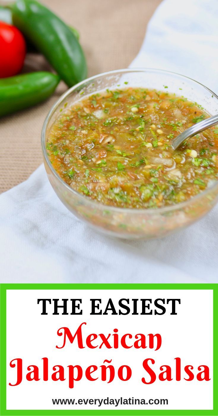 mexican jalapeno salsa in a glass bowl with a spoon on the side