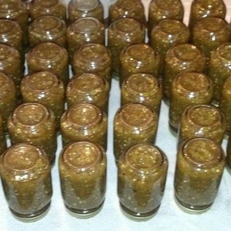 jars filled with peanut butter sitting on top of a table