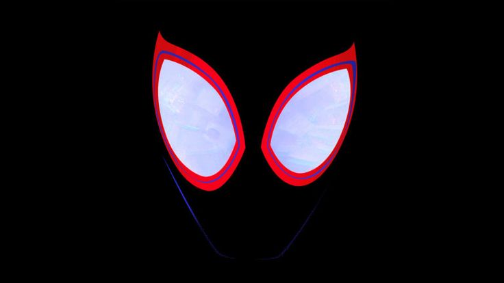 the spider - man mask is glowing in the dark, with its eyes wide open