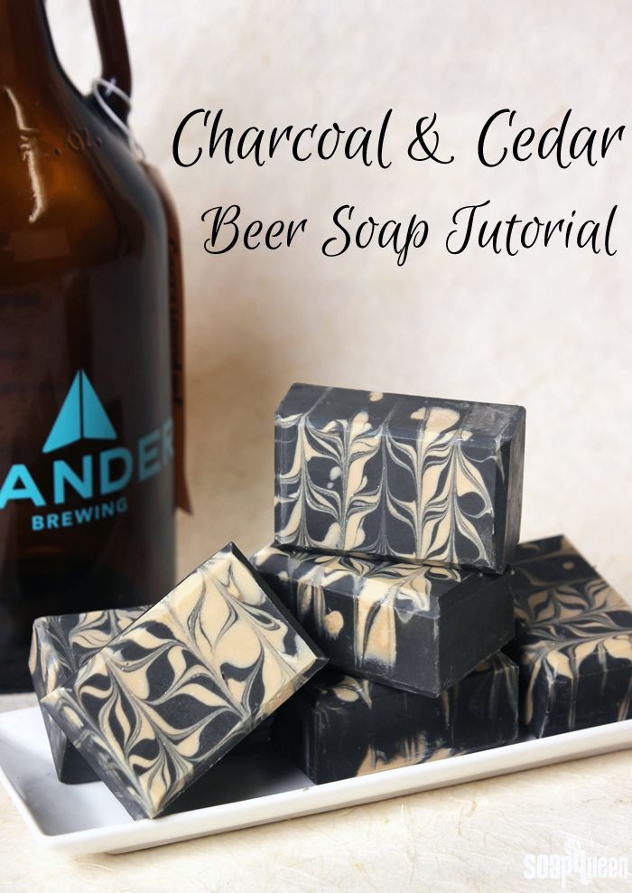 chocolate and cedar beer soaps on a plate next to a brown bottle with the words, charcoal & cedar beer soap