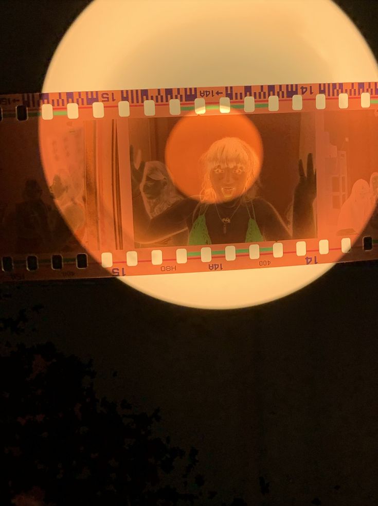 a film strip with an image of a man wearing a hat