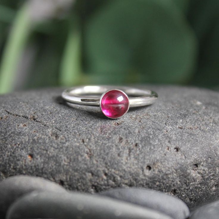 Sterling Silver Hot Pink Ruby Stacking Ring – AccentYourself Classic Ruby Ring With Tension Setting For Gift, Classic Ruby Ring With Tension Setting As Gift, Pink Bezel Set Stackable Rings For Anniversary, Ruby Promise Ring With Tension Setting, Gemstone Stackable Rings With Round Band, Fine Jewelry Stackable Round Ruby Ring, Fine Jewelry Red Birthstone Stackable Rings, Stackable Gemstone Rings With Round Band As A Gift, Red Birthstone Stackable Rings Fine Jewelry