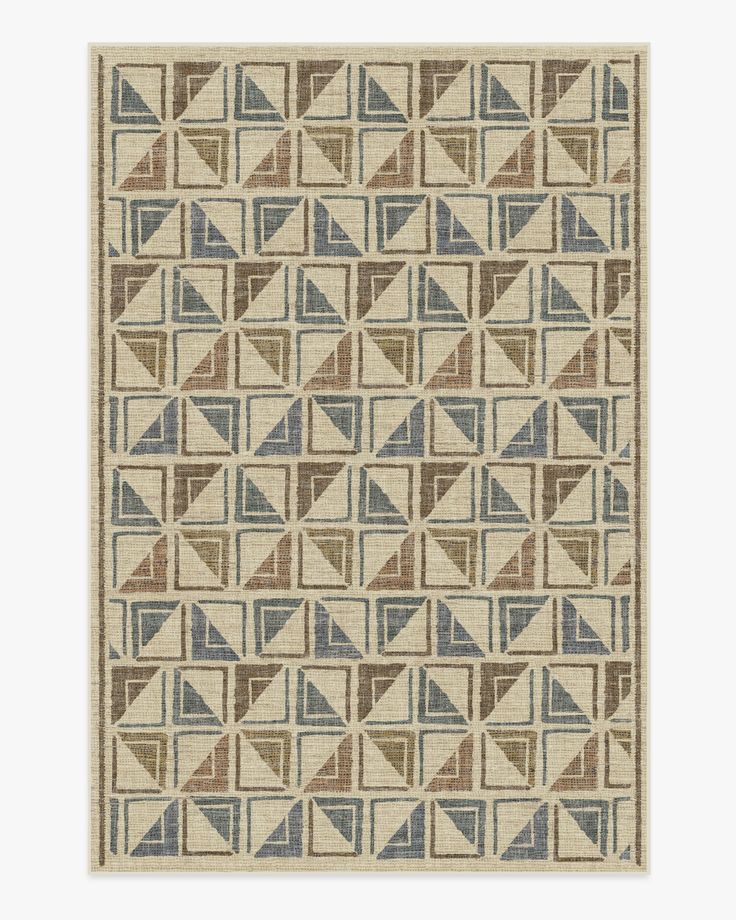 a beige and blue rug with geometric shapes on the bottom, in various shades of brown