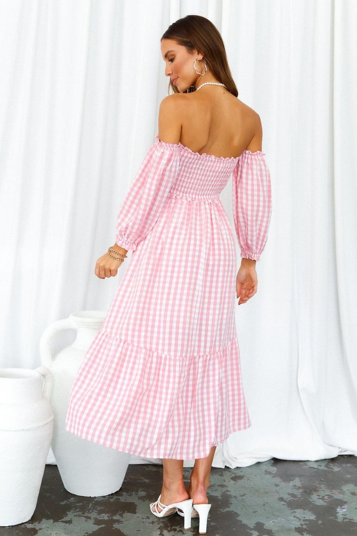 Length from neckline to hem of size S: 101cm. Pink gingham midi dress. Partially lined. Cold hand wash only. Model is a standard XS and is wearing size XS. True to size. Shirred, stretchy top. Lightweight, non-stretchy woven fabric. Adjustable shoulder straps. No zipper. Slip-on style. Rayon. Live the cottagecore dream in our Kiss Me At Sunset Midi Dress! With a sweet gingham print, off-the-shoulder sleeves and ruffled skirt, you'll be running away for a countryside life this summer. Don't forget to style yours with tousled waves, lace-up sandals and a woven bag. Spring Plaid Midi Dress Knee-length, Picnic Plaid Midi Dress With Ruffles, Fitted Knee-length Midi Dress For Picnic, Plaid Midi Dress With Ruffles For Picnic, Pink Fitted Midi Dress For Picnic, Gingham Midi Dress For Garden Party, Summer Gingham Midi Dress For Picnic, Fitted Pink Midi Dress For Picnic, Spring Plaid Dress For Garden Party